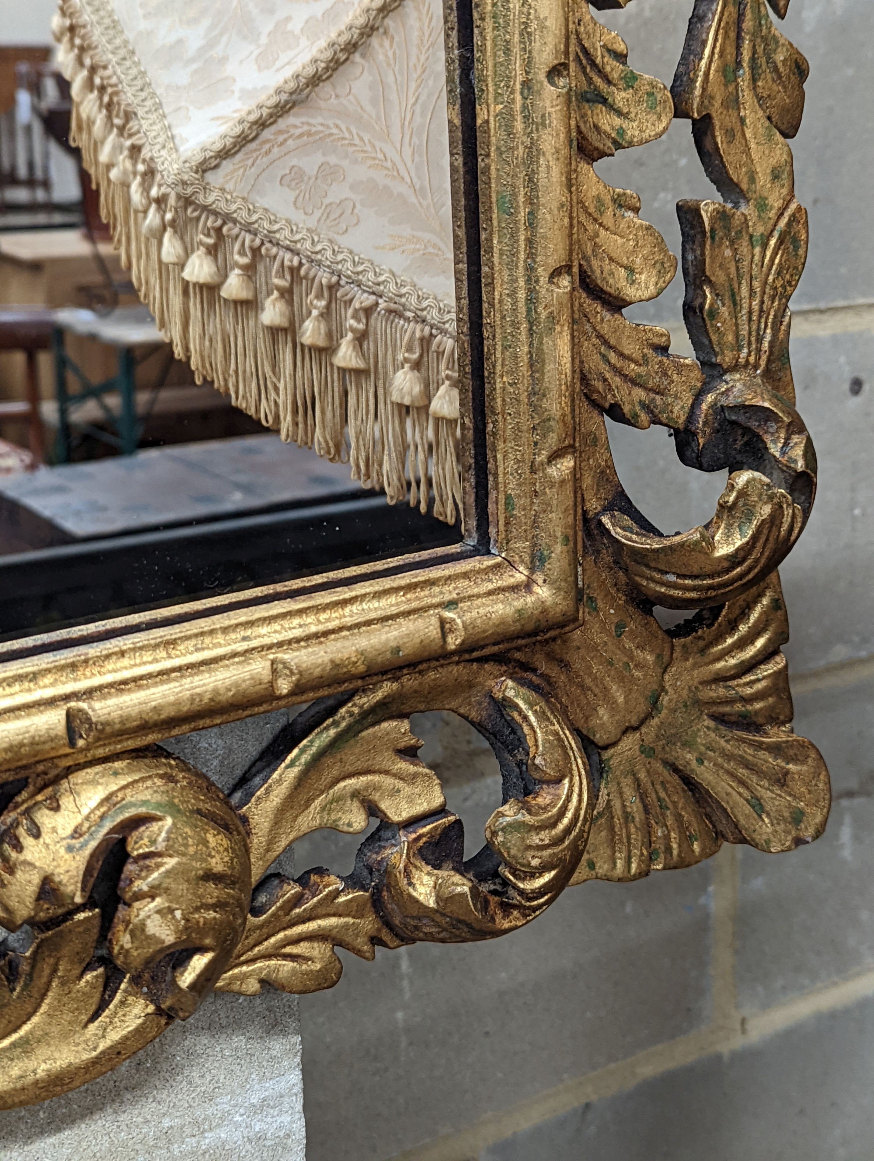 A Florentine style carved giltwood wall mirror, width 80cm, height 70cm